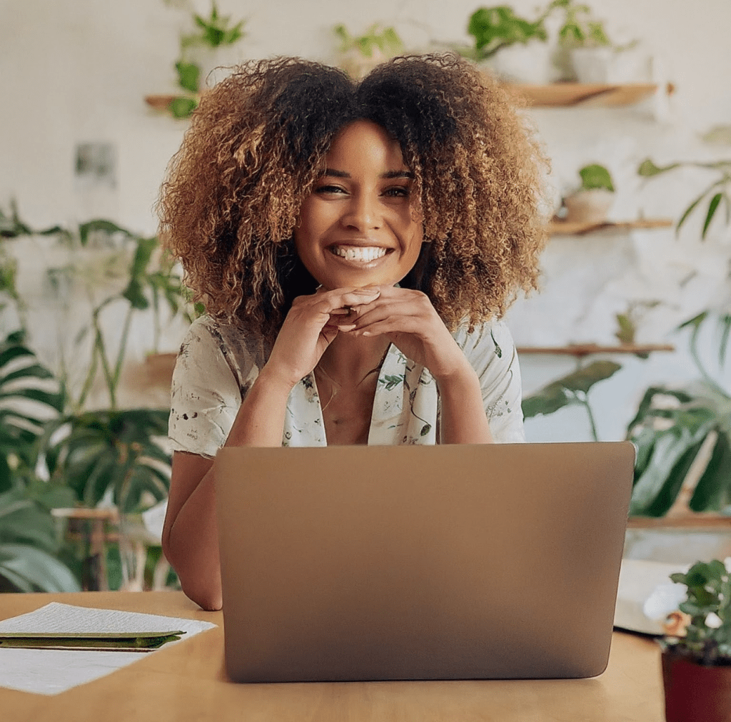 Woman smiling because her online virtual bookkeeper has kept her accounts accurate and compliant and is eco friendly